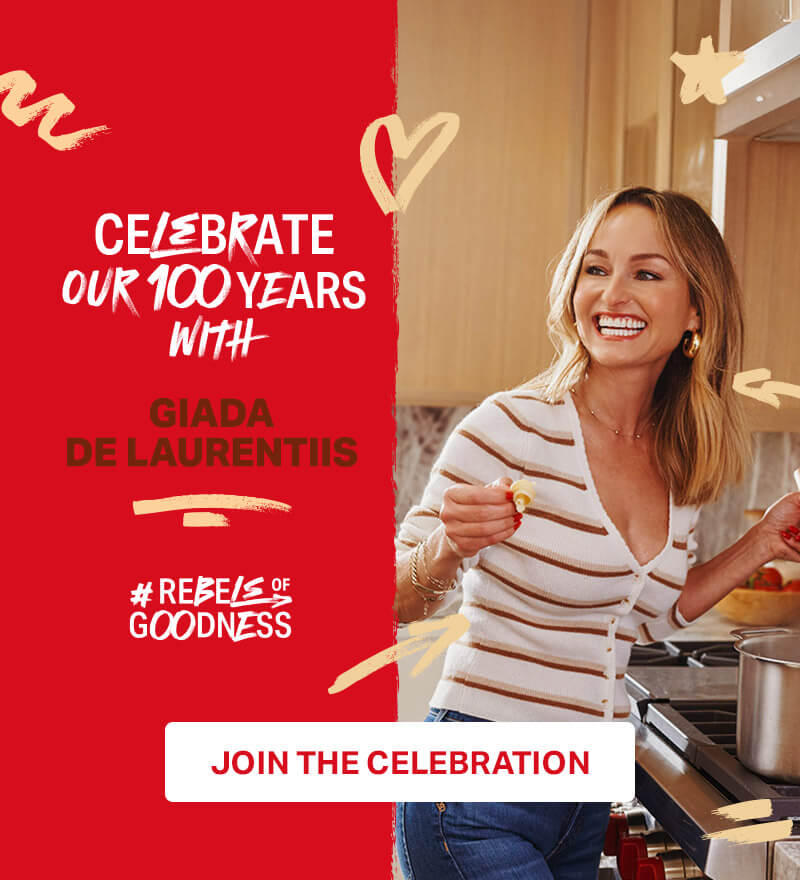 celebrate our 100 years with Giada De Laurentiis #Rebels of goodness; Giada De Laurentiis cooking pasta in the kitchen