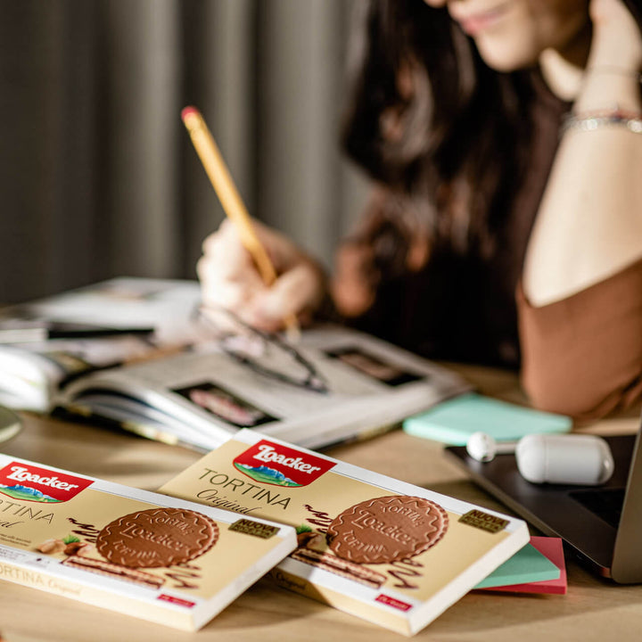 Tortina Original, Chocolate Coated Wafer Specialty, 4.44 oz. Box with lady writing at the background